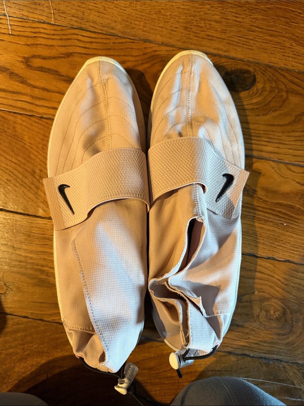 Nike Men’s Slip-On Training Shoes in Pale Pink with Black Swoosh